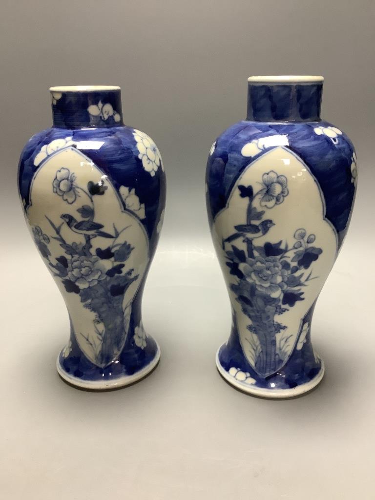 A pair of Chinese blue and white vases, Kangxi mark c.1900, height 22.5cm